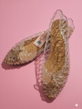 Juicy Couture Clear Bow Jelly Flats with Gold Cork Insole